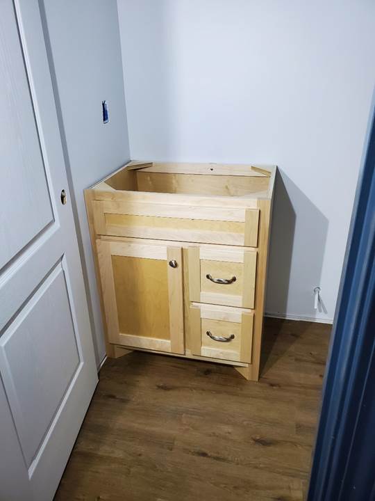A wooden dresser in a room

Description automatically generated with medium confidence