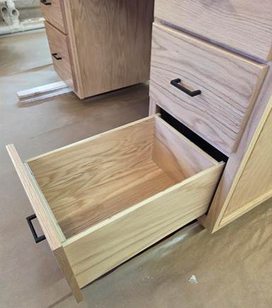 A wooden drawer with a drawer open

AI-generated content may be incorrect.