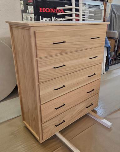 A dresser in a room

AI-generated content may be incorrect.