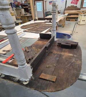A wood table in a workshop

AI-generated content may be incorrect.